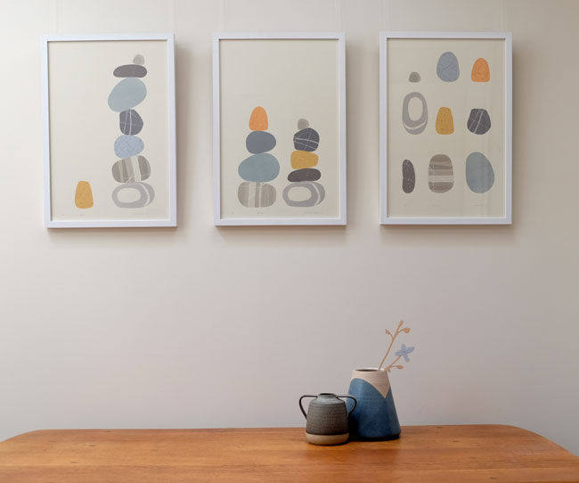 photograph og three framed pebble prints by Emily Ketteringham